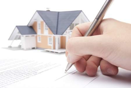 signing a loan mortgage form